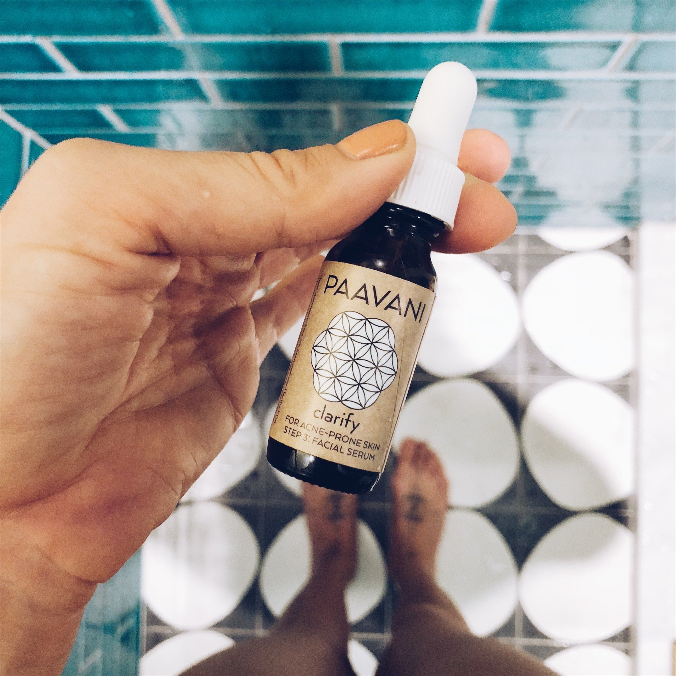 Clarify Serum in a 0.5 oz glass bottle, showcasing its organic ingredients for clear skin.