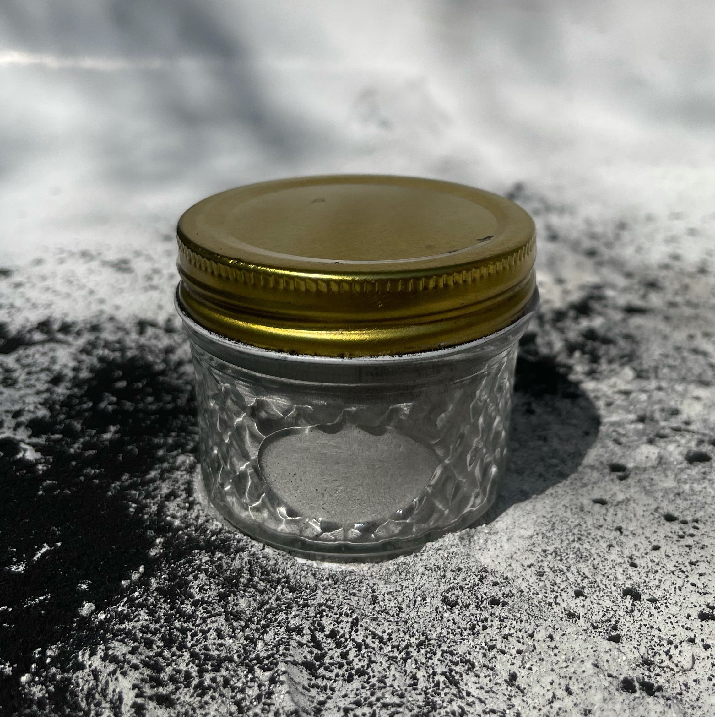 A 4 oz reusable jar of clay mask with natural ingredients, showcasing its detoxifying and purifying properties.