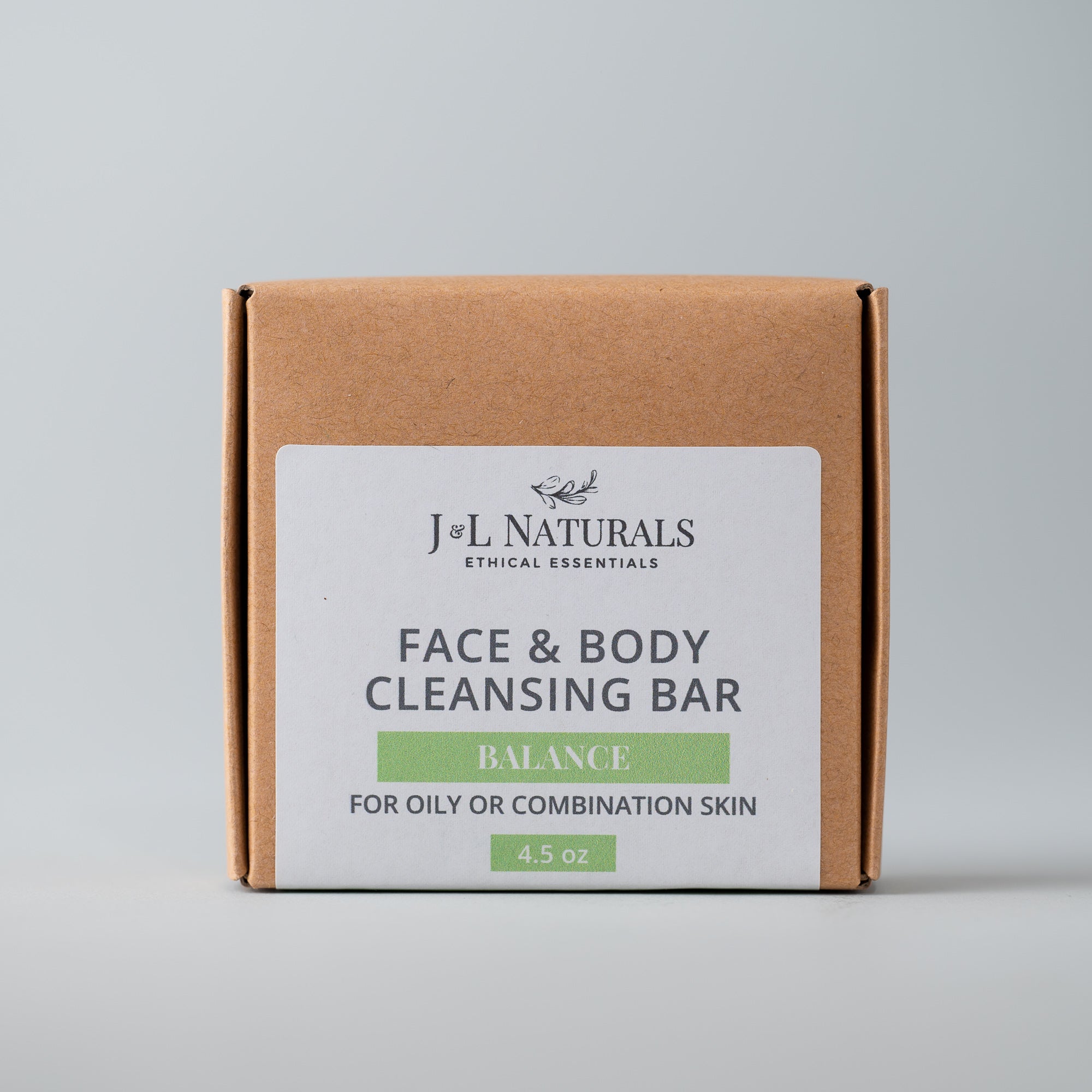 A natural Cleansing Bar displayed on a wooden surface, showcasing its smooth texture and eco-friendly packaging.