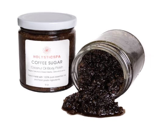 A jar of Coffee Sugar Body Polish with a wooden scoop, showcasing its rich, textured consistency and natural ingredients.