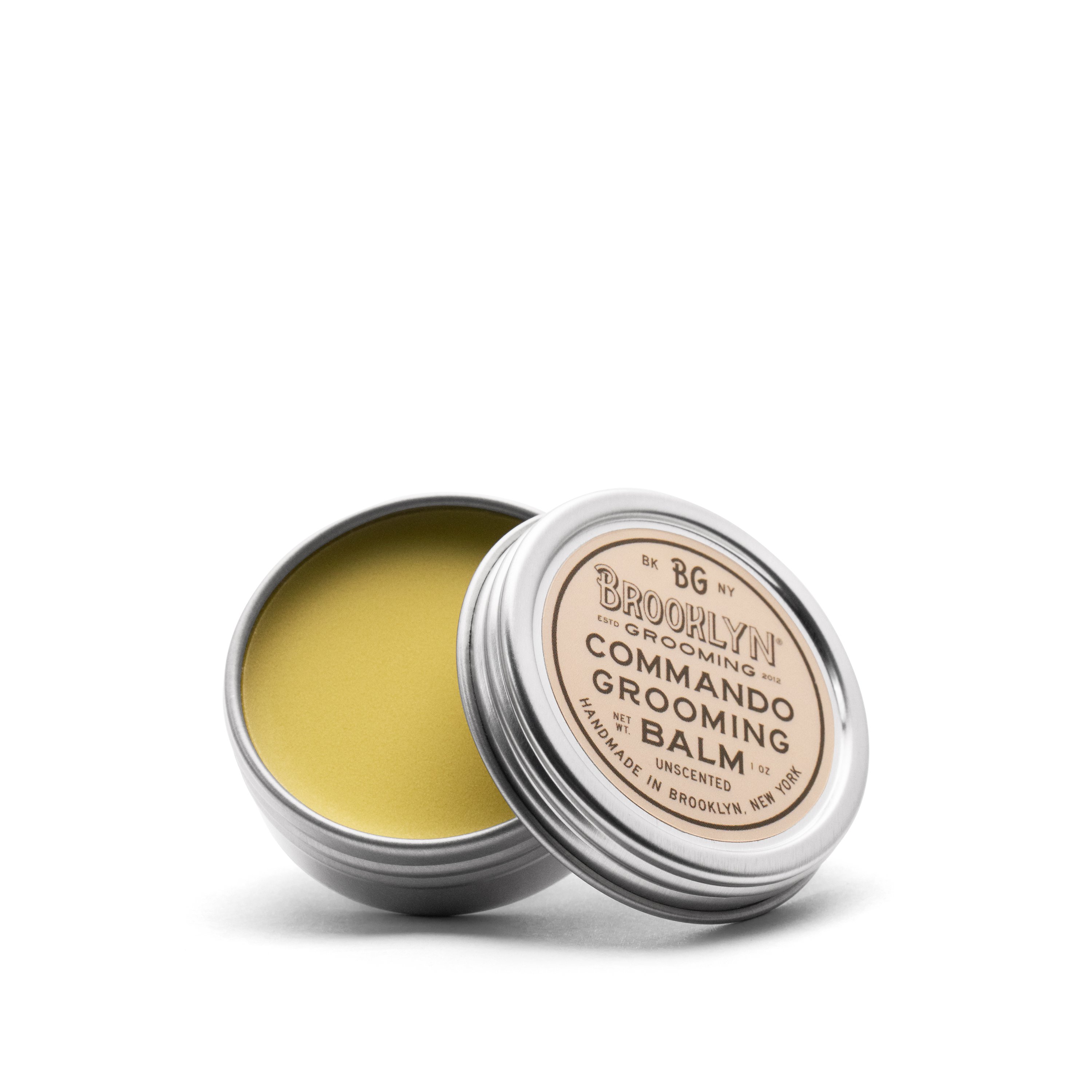 Commando Grooming Balm in a sleek aluminum tin, showcasing its natural ingredients and unisex appeal.