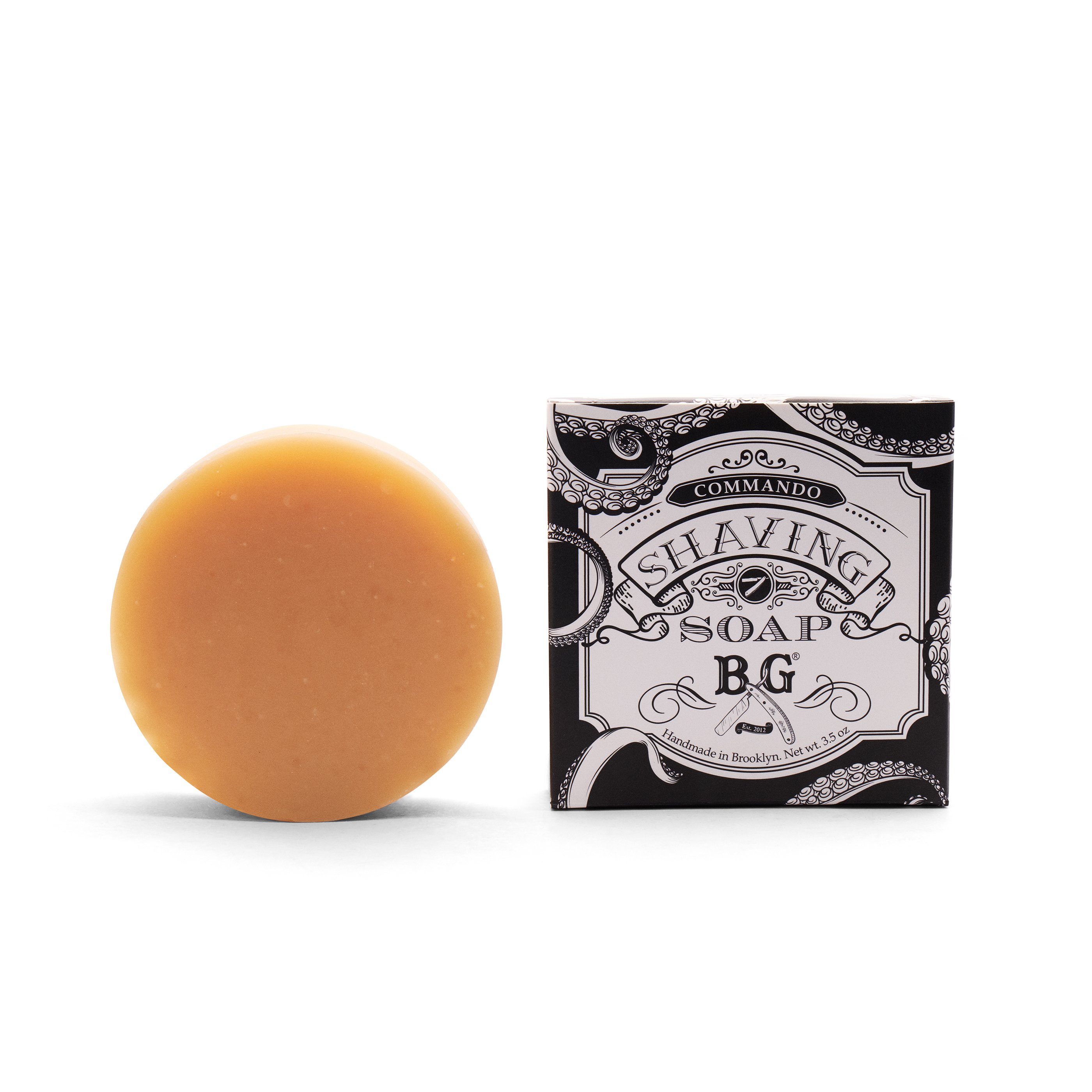 Commando Shaving Soap in a round shape, showcasing its creamy texture and organic ingredients, perfect for a luxurious shaving experience.