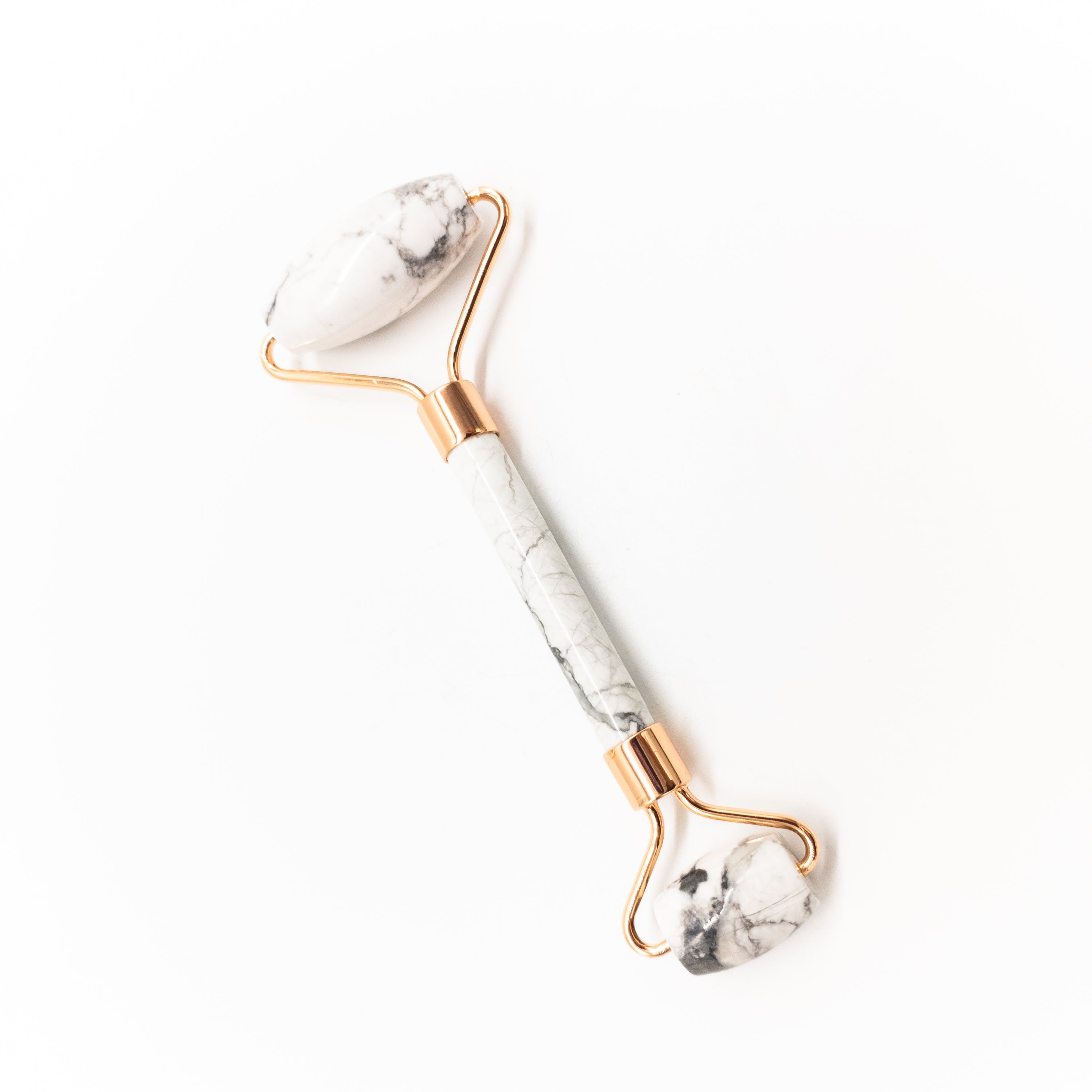 Copper & Crystal Face Roller featuring natural polished crystals, designed for facial massage and skincare.