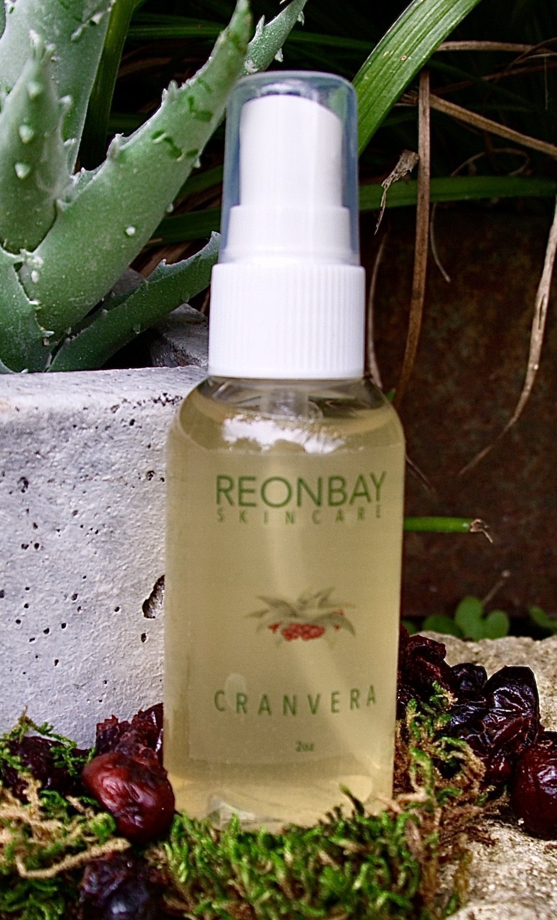 CranVera Serum Spray bottle featuring a sleek design with a refreshing mist sprayer, showcasing its natural ingredients like Lingonberry and Goji berry.