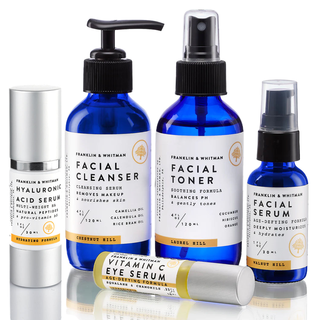 Daily Face Care Kit featuring cleansing serum, toner, and face serum in elegant packaging.