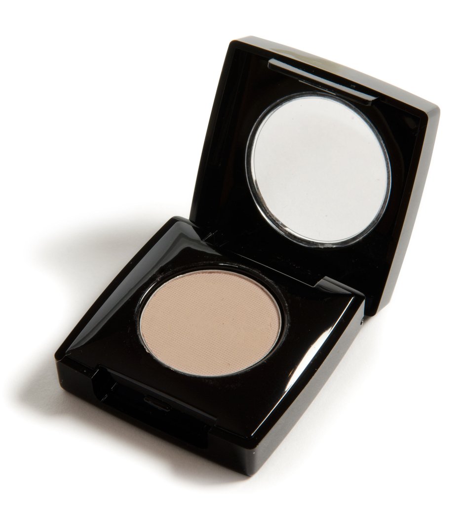 Danyel Eyelight Shadow in Doe, showcasing a creamy powder formula in a sleek container, perfect for professional makeup application.