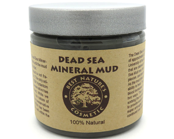 A jar of Dead Sea Mineral Mud showcasing its rich, dark texture, ideal for detoxifying and rejuvenating skin.