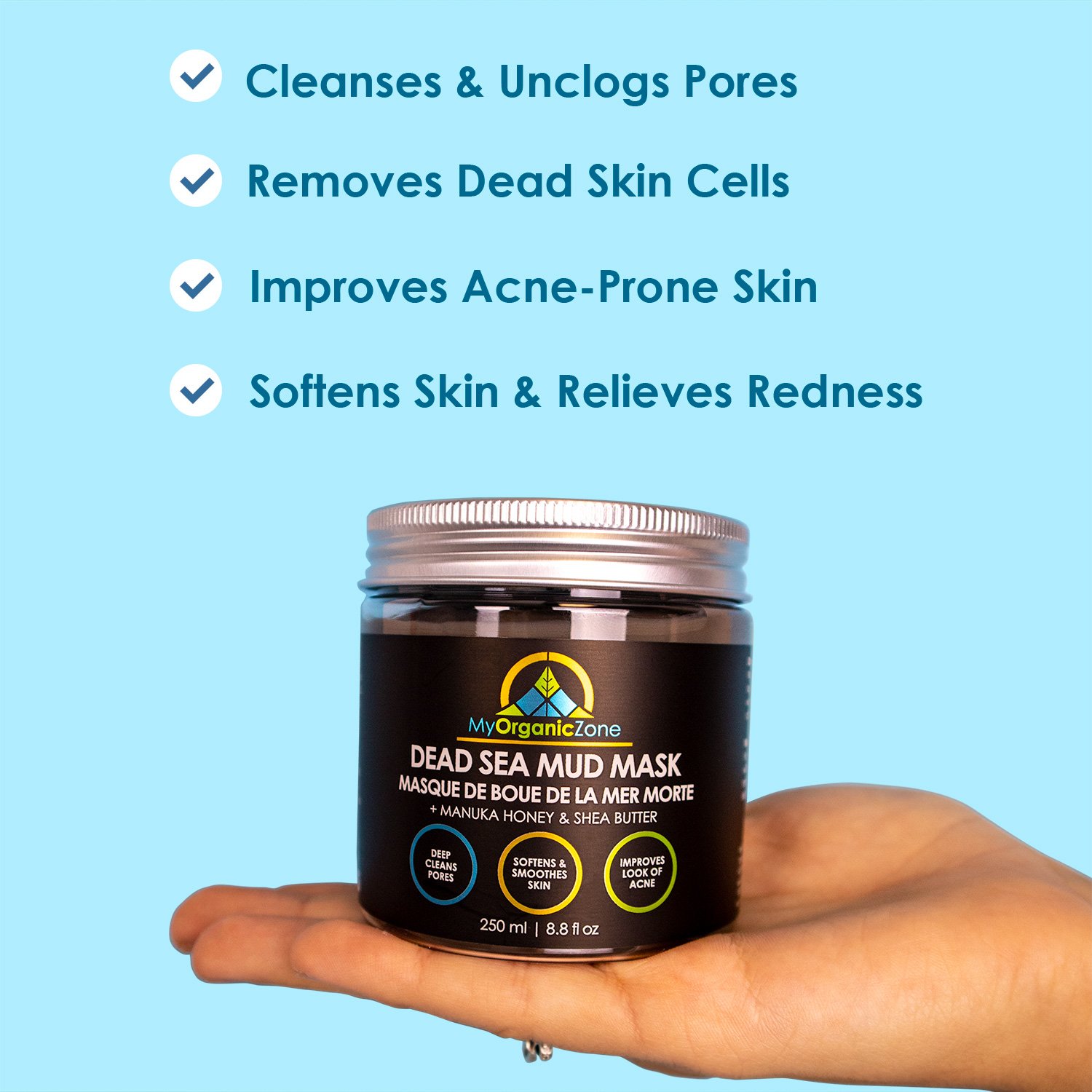 Dead Sea Mud Mask in a jar with a smooth texture, surrounded by natural ingredients like aloe vera and coconut oil.