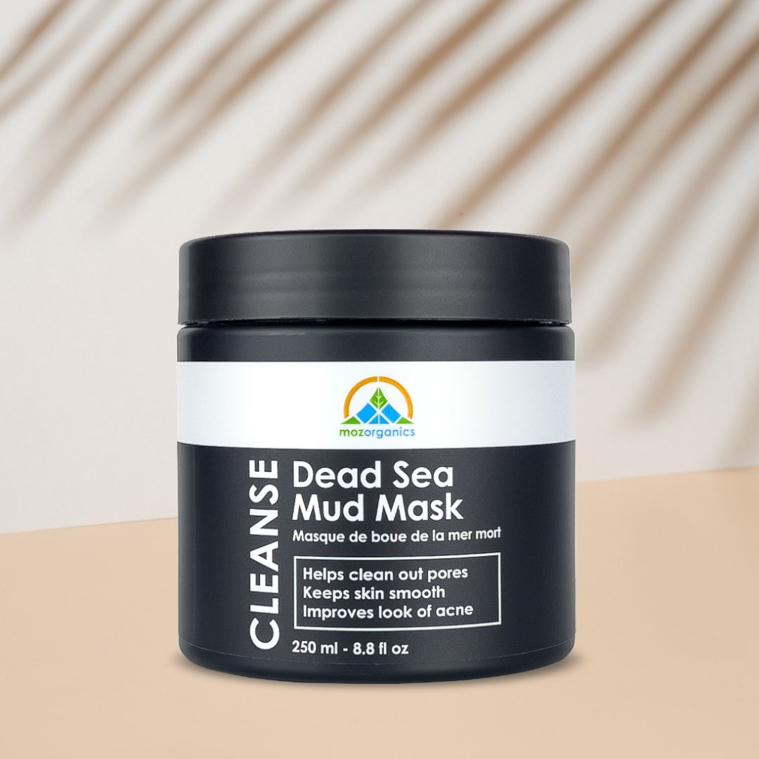 Dead Sea Mud Mask in a jar with a smooth texture, surrounded by natural ingredients like aloe vera and coconut oil.