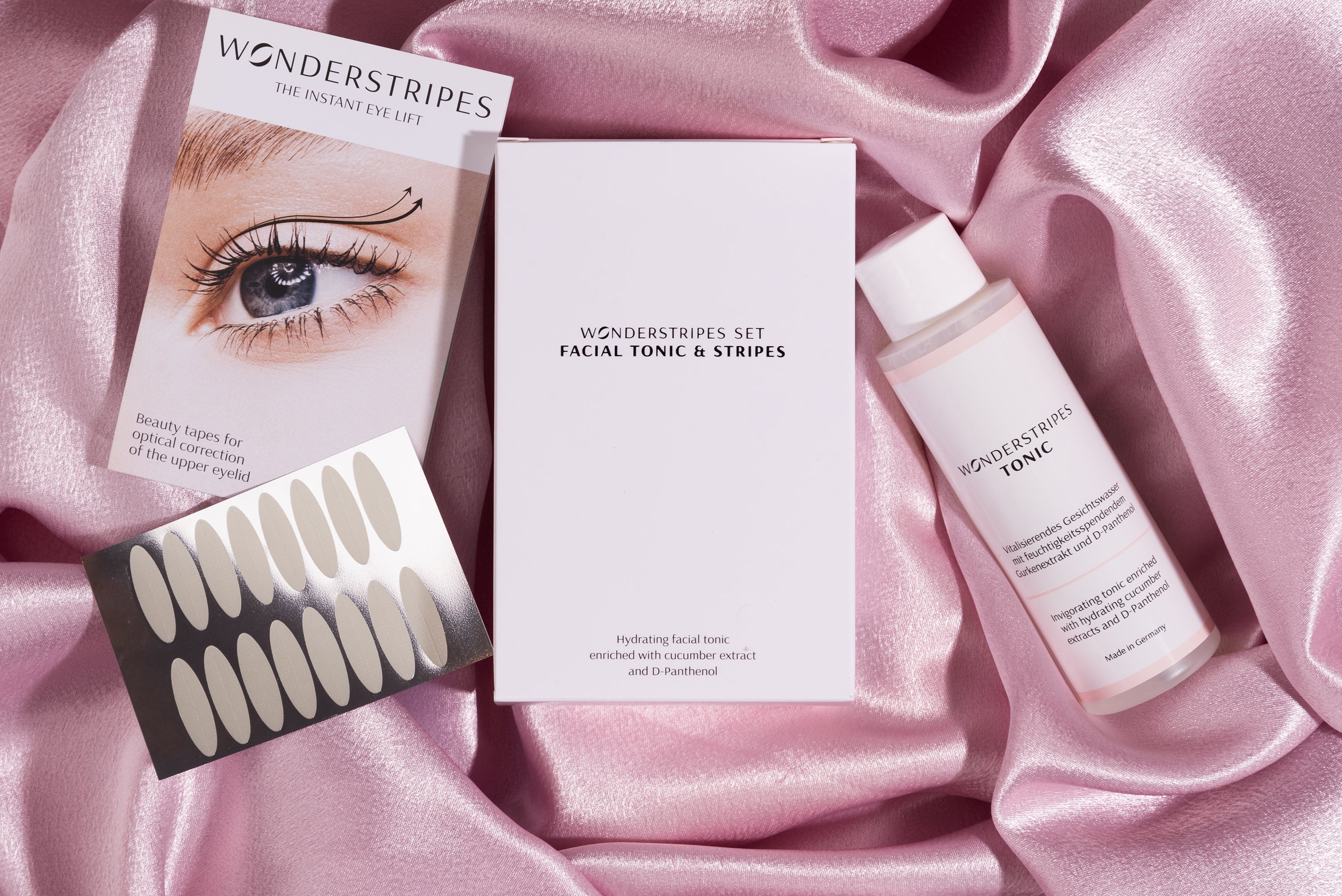 Eye Lifting Kit featuring a facial toner and various sizes of eyelid lifting strips for a youthful appearance.