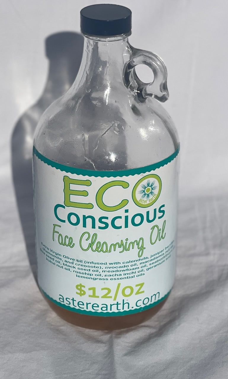 A bottle of Face Cleansing Oil surrounded by natural ingredients like herbs and flowers, showcasing its organic composition.