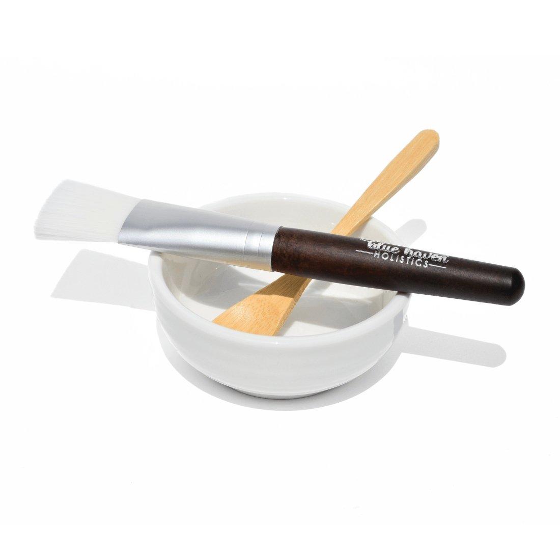 Face Mask Mixing Kit featuring a white porcelain bowl, bamboo spoon, and vegan brush for skincare application.