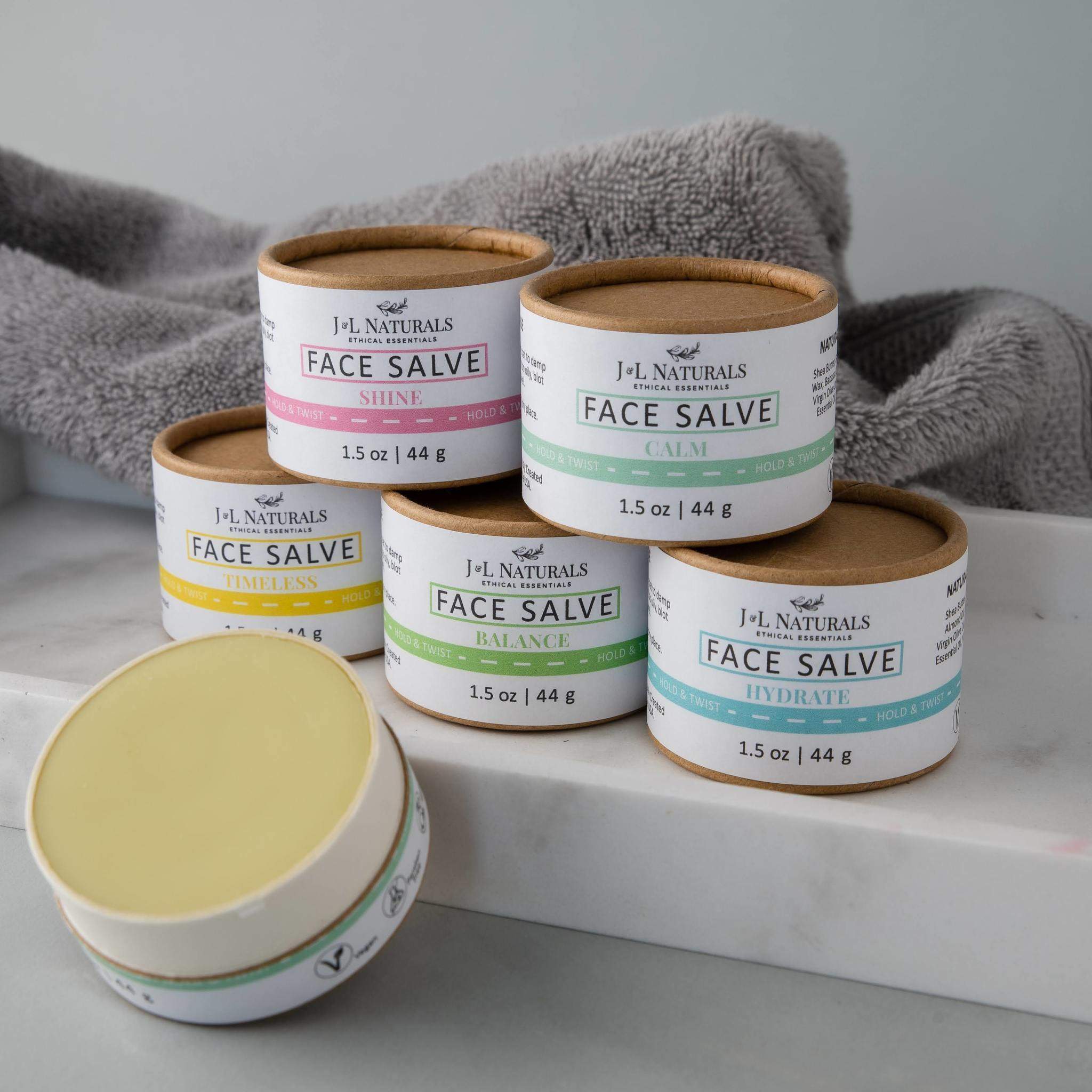 Two jars of ultra-nourishing Face Salve Duo, showcasing their buttery texture and packaging.