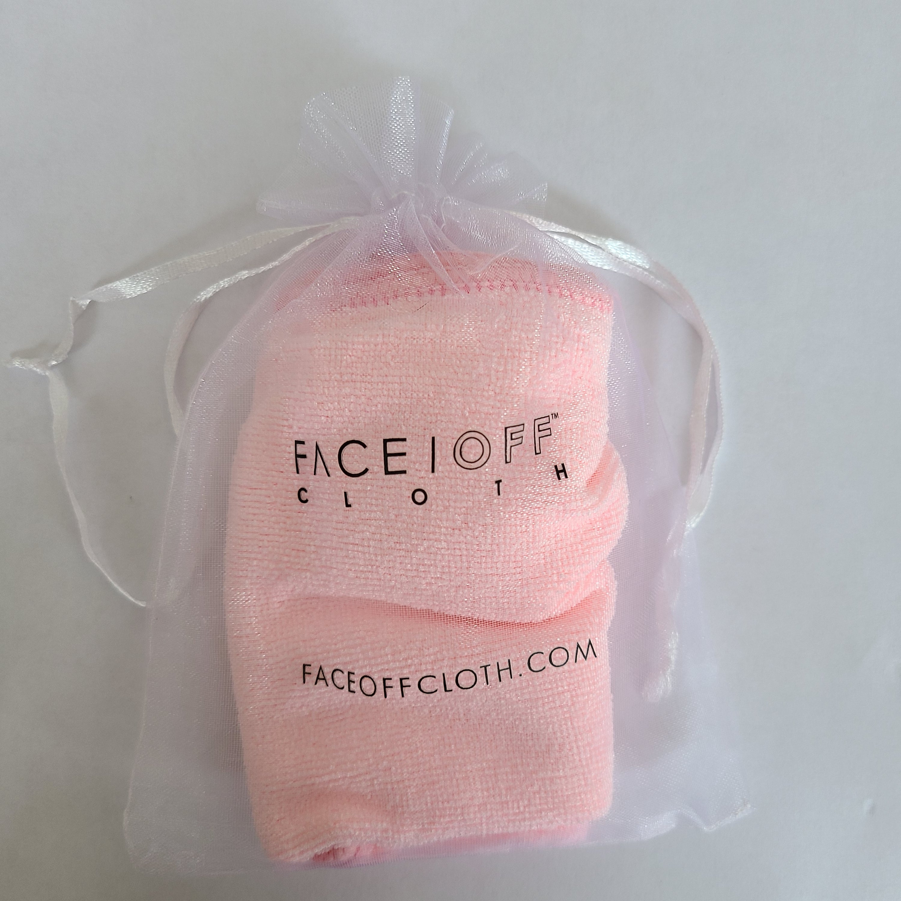 FaceOff Trial Cloth displayed on a clean surface, showcasing its soft texture and reusable design for makeup removal.