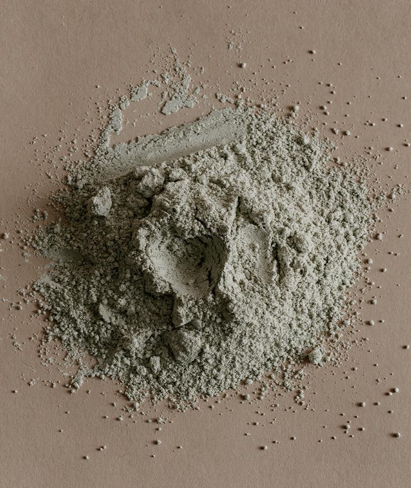 Forma Viridi powder blend in an apothecary bottle, showcasing its natural ingredients and earthy tones.