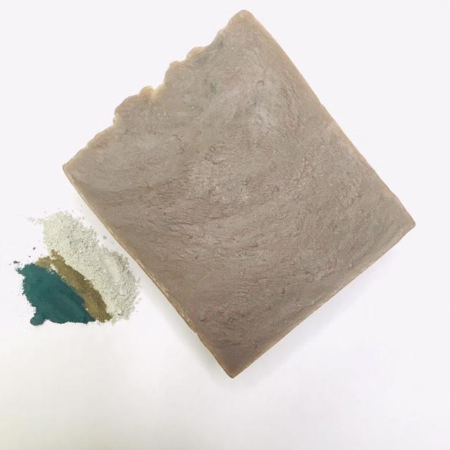 French Green Tea Soap bar with natural ingredients like green tea, cocoa butter, and olive oil, showcasing its creamy texture and vibrant color.