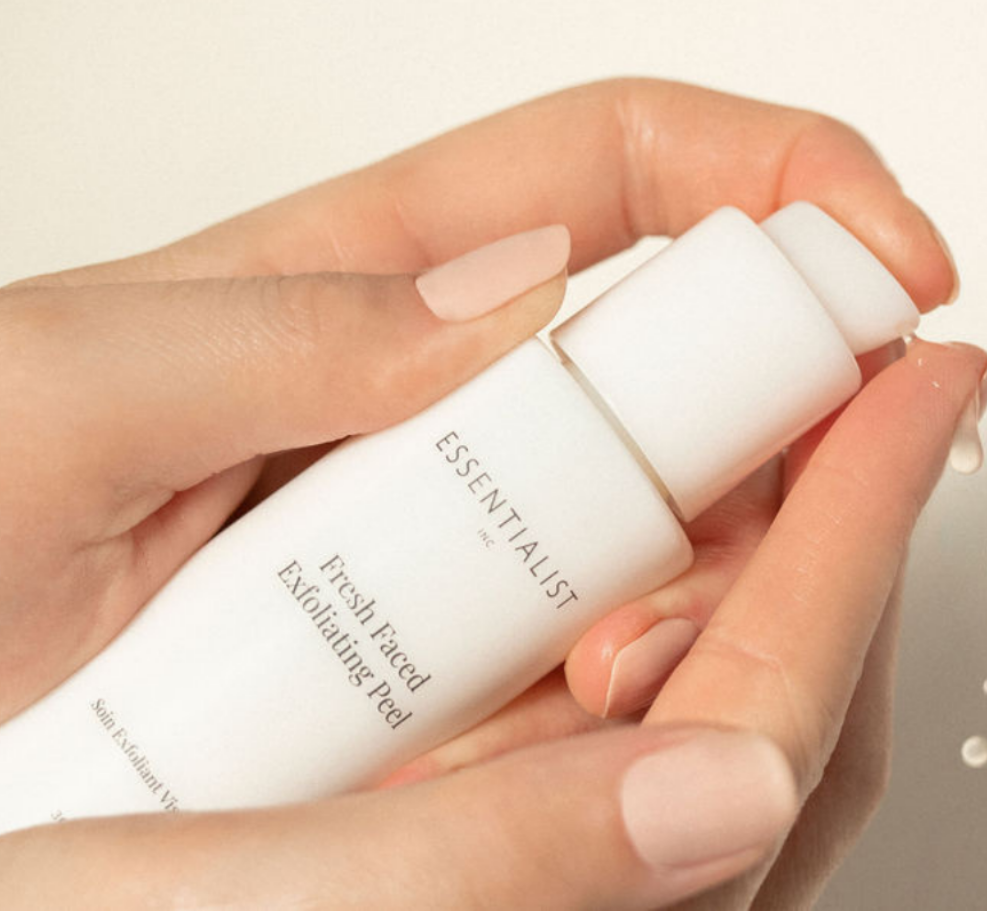 Fresh Faced Exfoliating Peel bottle with a sleek design, showcasing its key ingredients like Lactic Acid and Vitamin C.