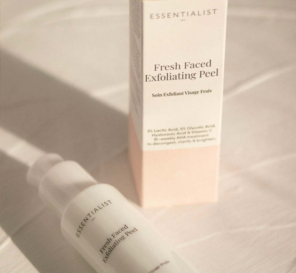 Fresh Faced Exfoliating Peel bottle with a sleek design, showcasing its key ingredients like Lactic Acid and Vitamin C.