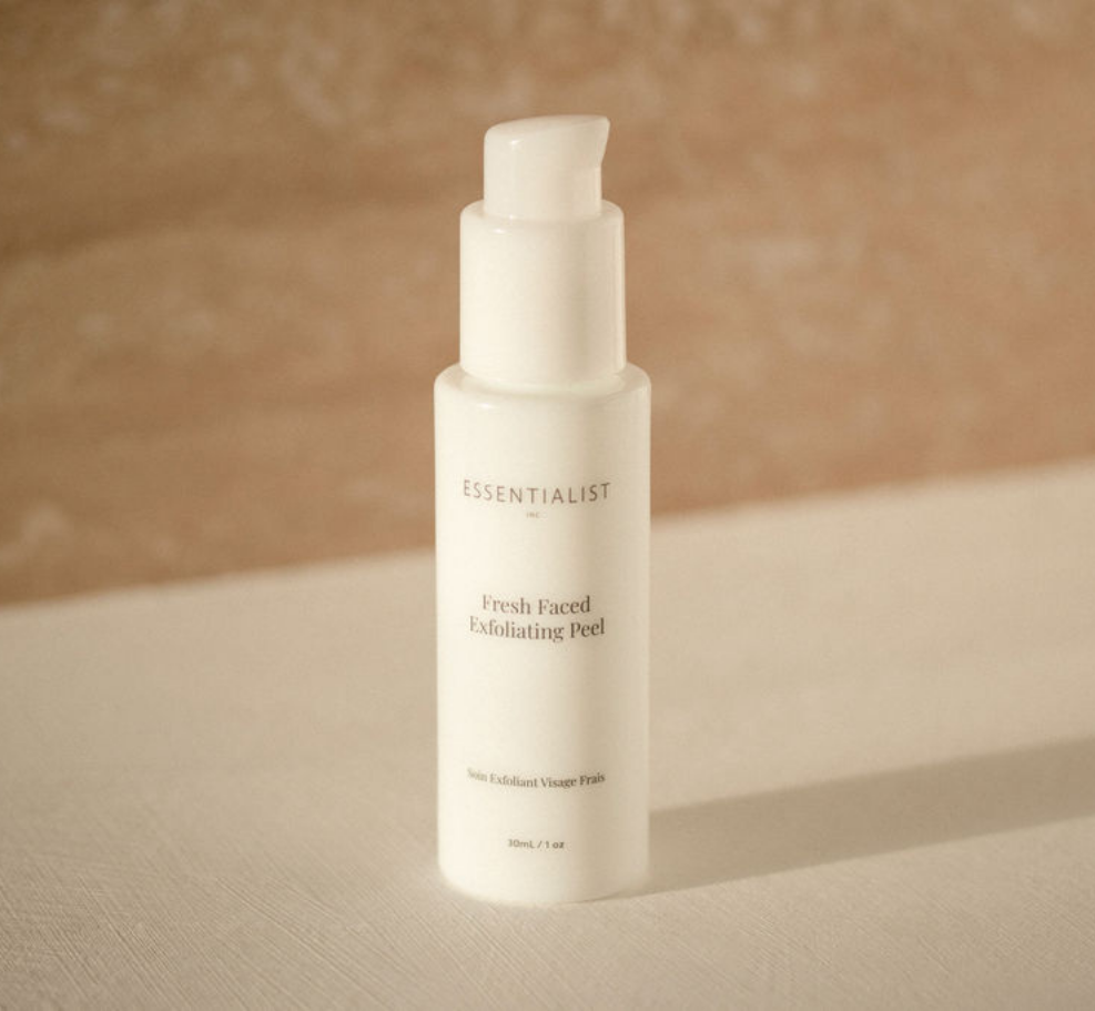 Fresh Faced Exfoliating Peel bottle with a sleek design, showcasing its key ingredients like Lactic Acid and Vitamin C.