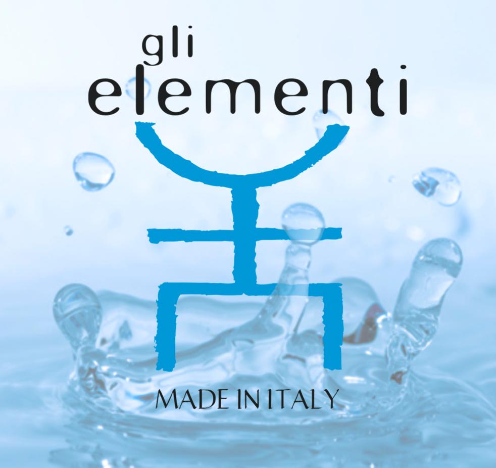 A collection of Gli Elementi Sample Experiences showcasing spa-grade skincare products in elegant packaging, perfect for travel.