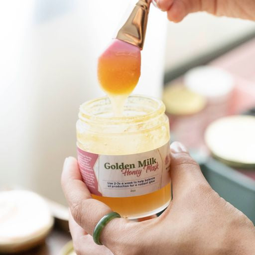 Golden Milk Honey Mask in a 2oz glass jar, showcasing its rich, golden texture and natural ingredients.