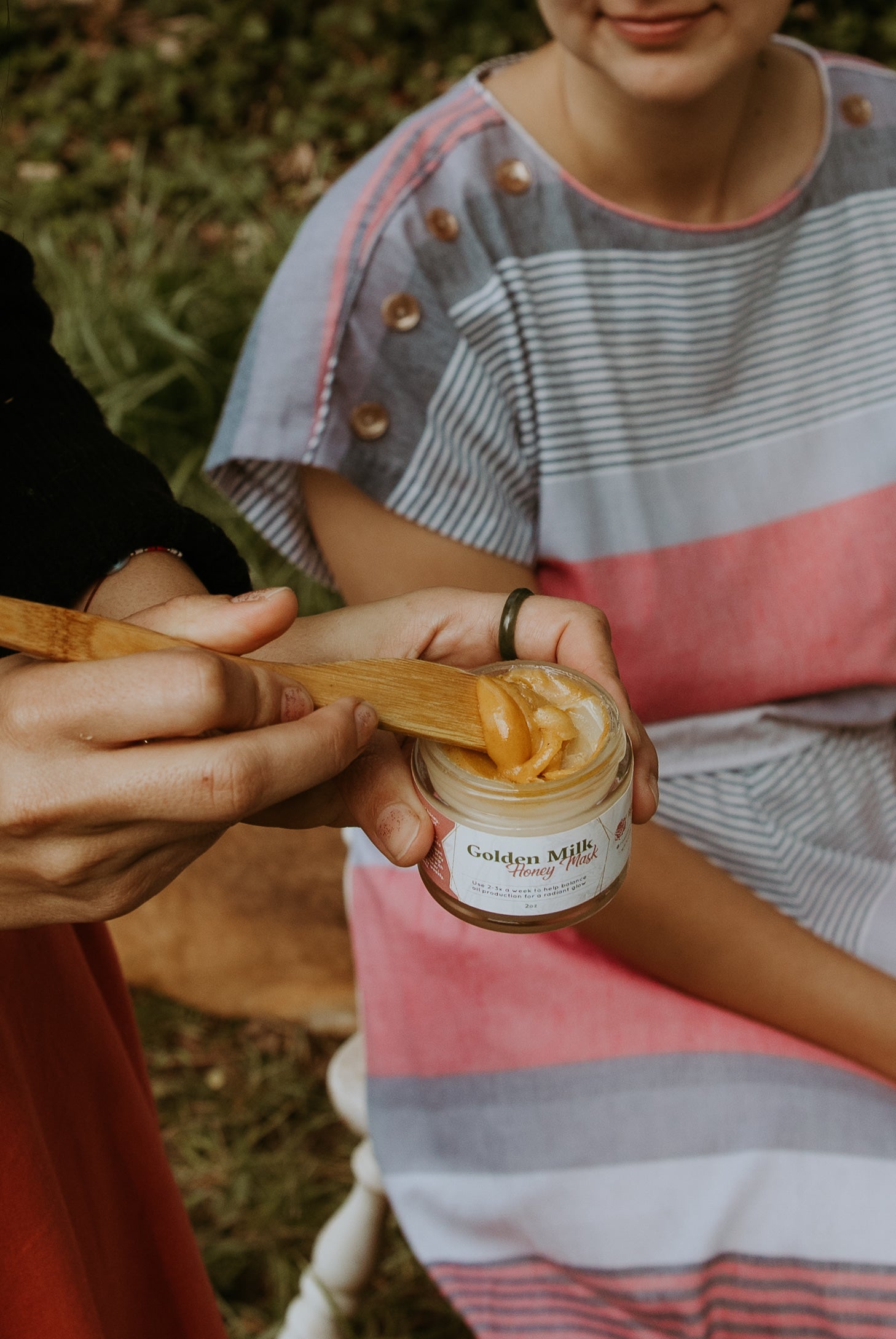 Golden Milk Honey Mask in a 2oz glass jar, showcasing its rich, golden texture and natural ingredients.