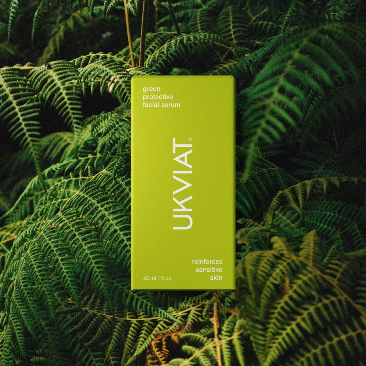 Green protective facial serum in a sleek bottle, showcasing its natural ingredients and eco-friendly packaging.