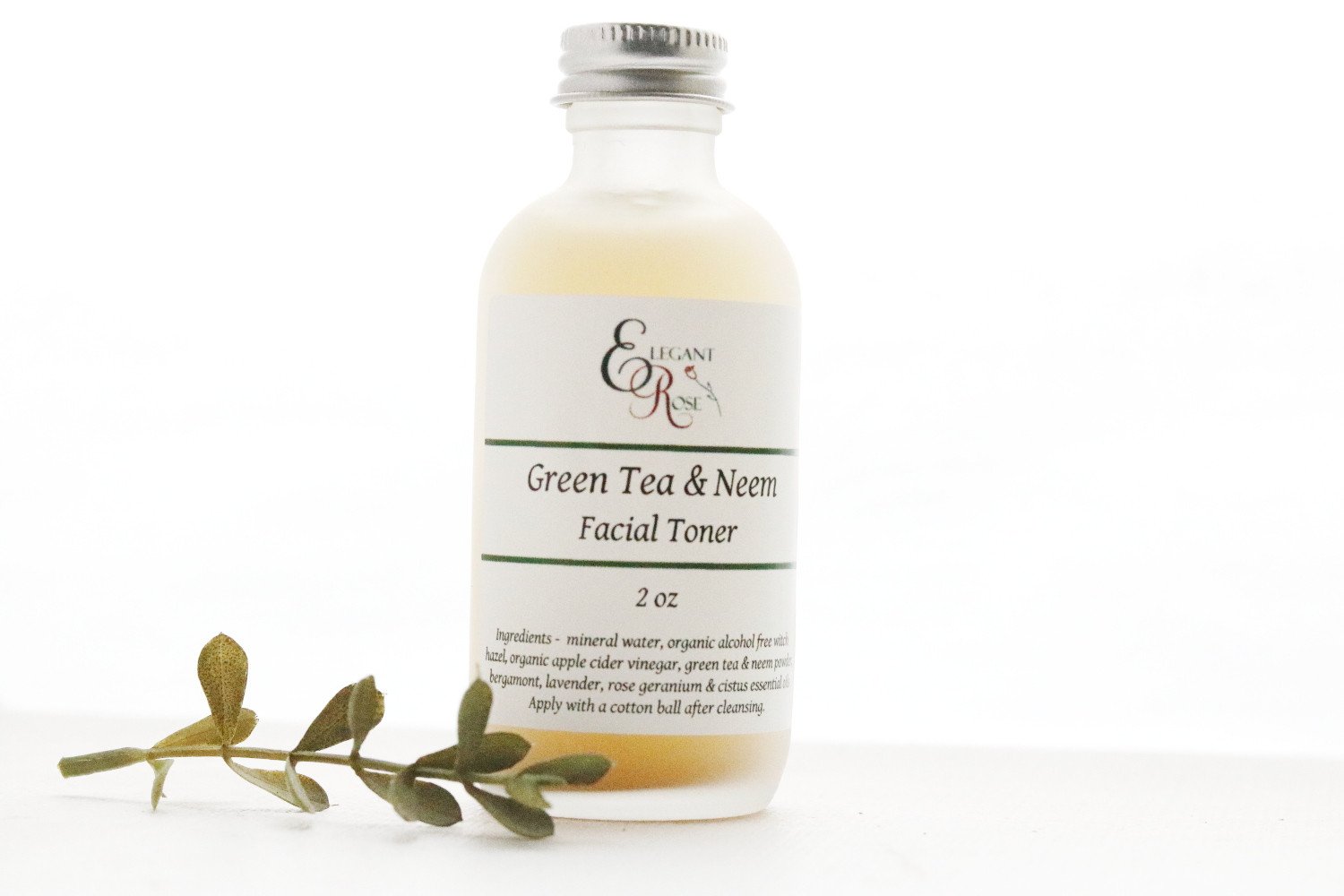 Green Tea & Neem Facial Toner in a glass bottle, designed for oily and acne-prone skin, featuring natural ingredients.