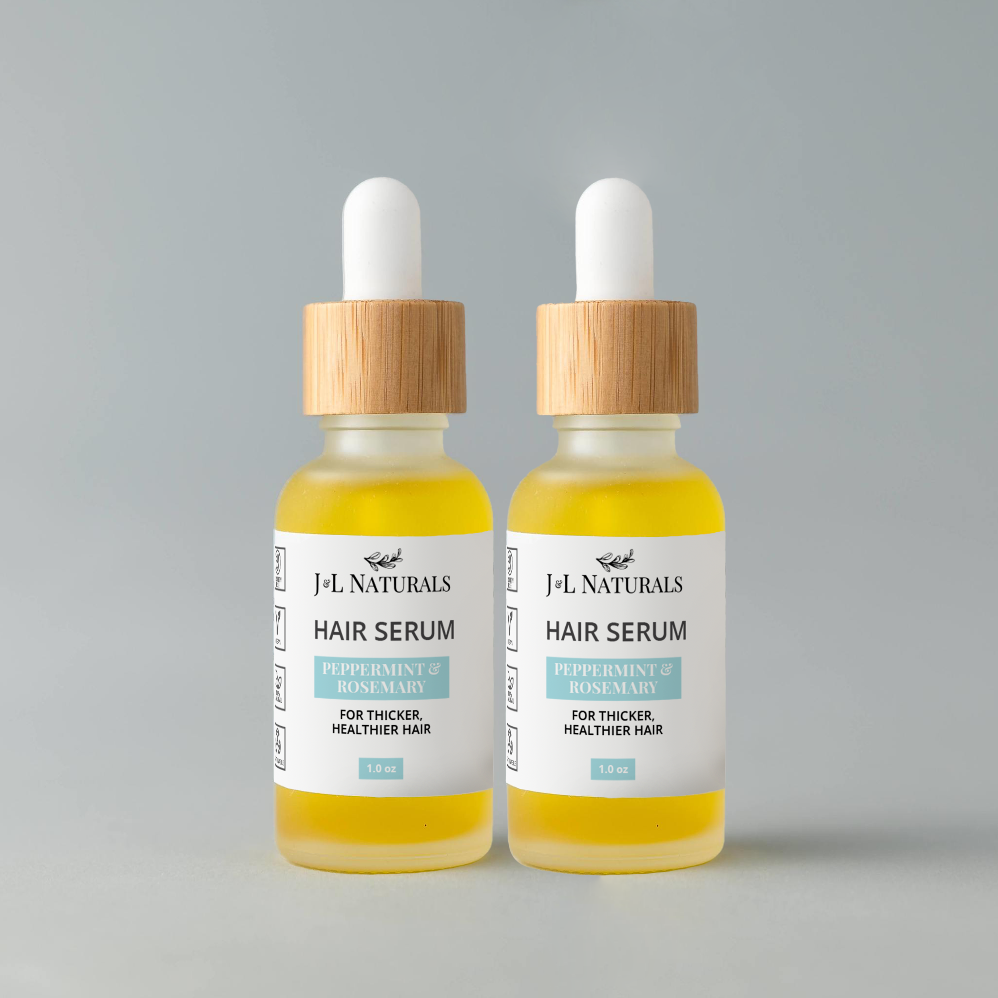 Hair Serum Duo featuring two 1.0 fl oz bottles with various scents for hair nourishment and care.