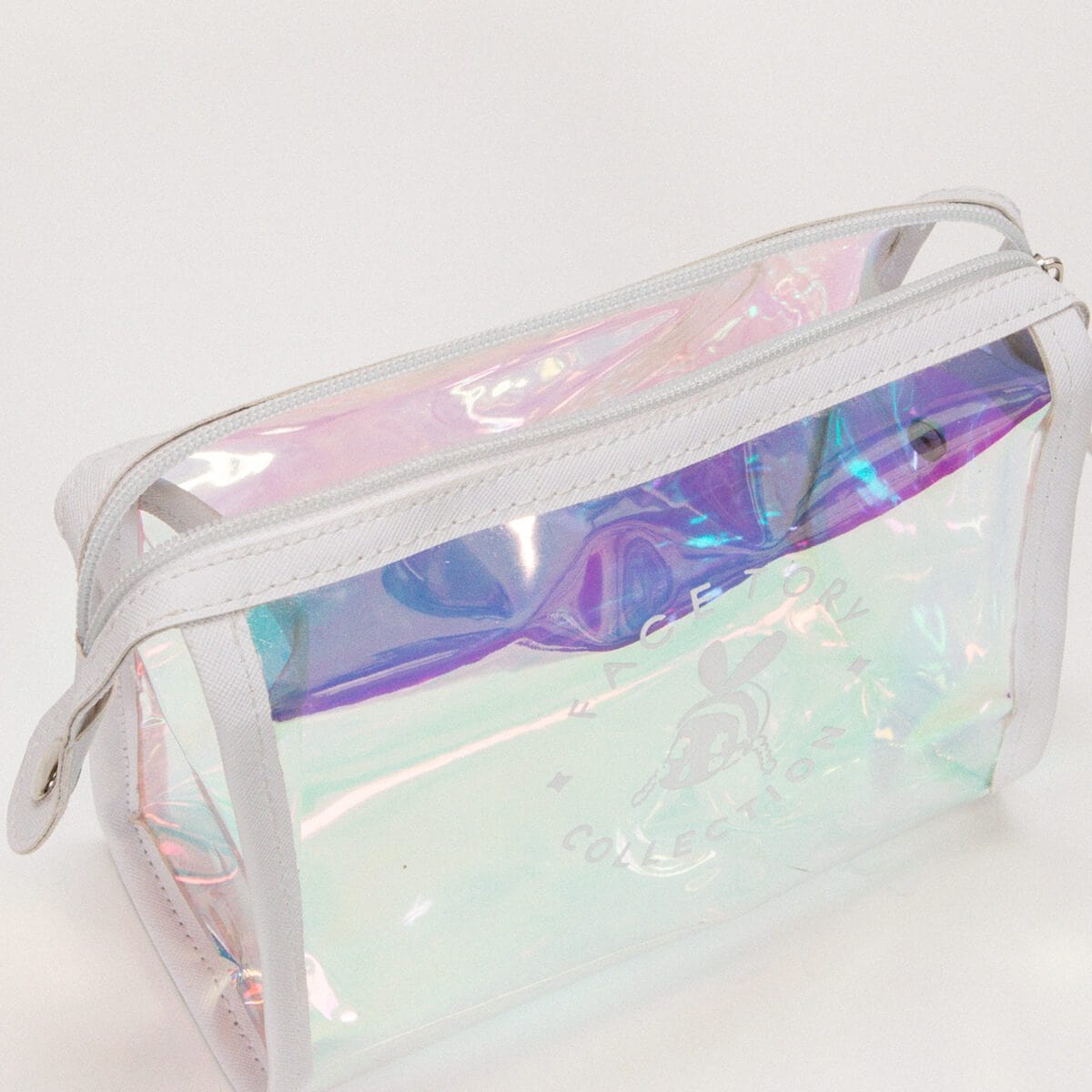 Halo-Daze Pouch featuring a holographic design and Tory logo, perfect for cosmetics and travel.