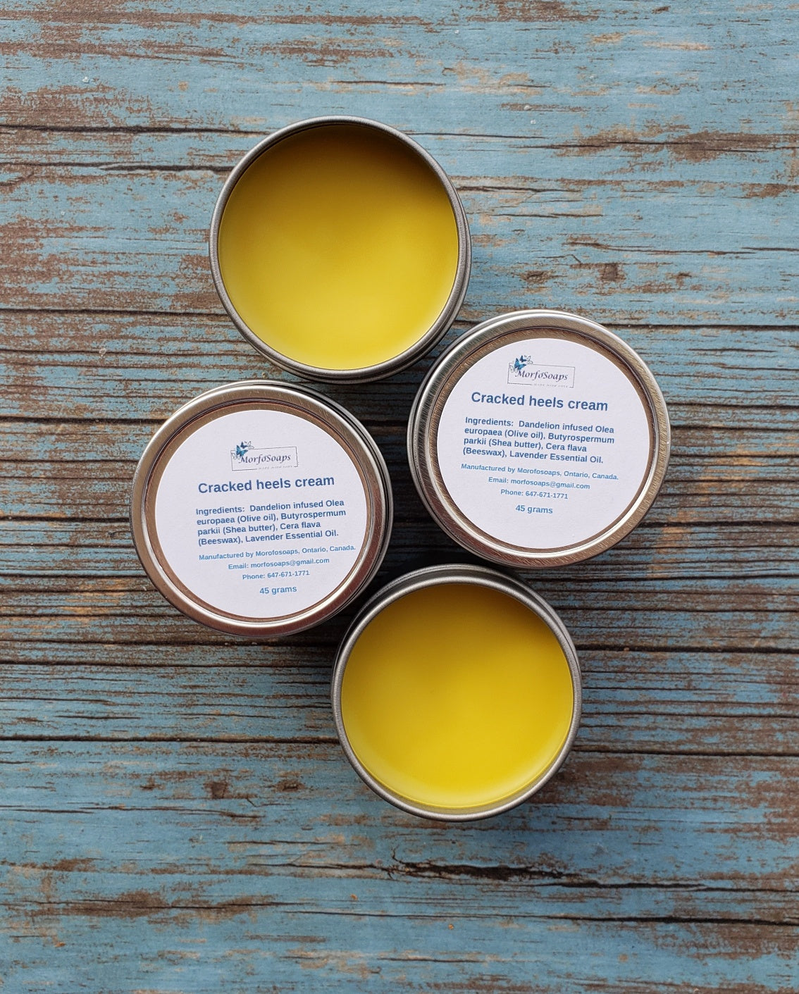 A jar of Handmade Cracked Heels Cream featuring natural ingredients like Dandelion, Shea butter, and beeswax, designed for foot care.