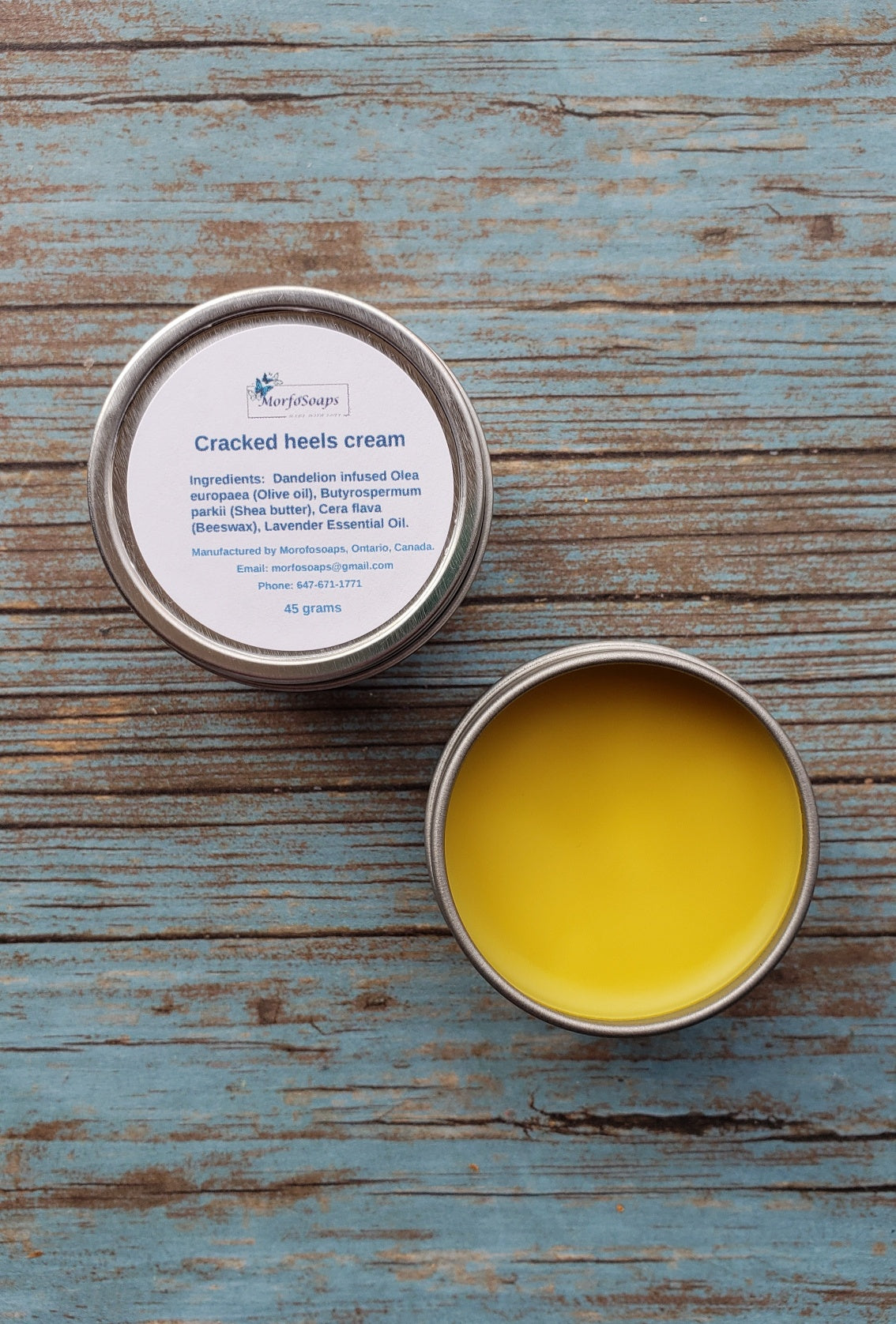 A jar of Handmade Cracked Heels Cream featuring natural ingredients like Dandelion, Shea butter, and beeswax, designed for foot care.