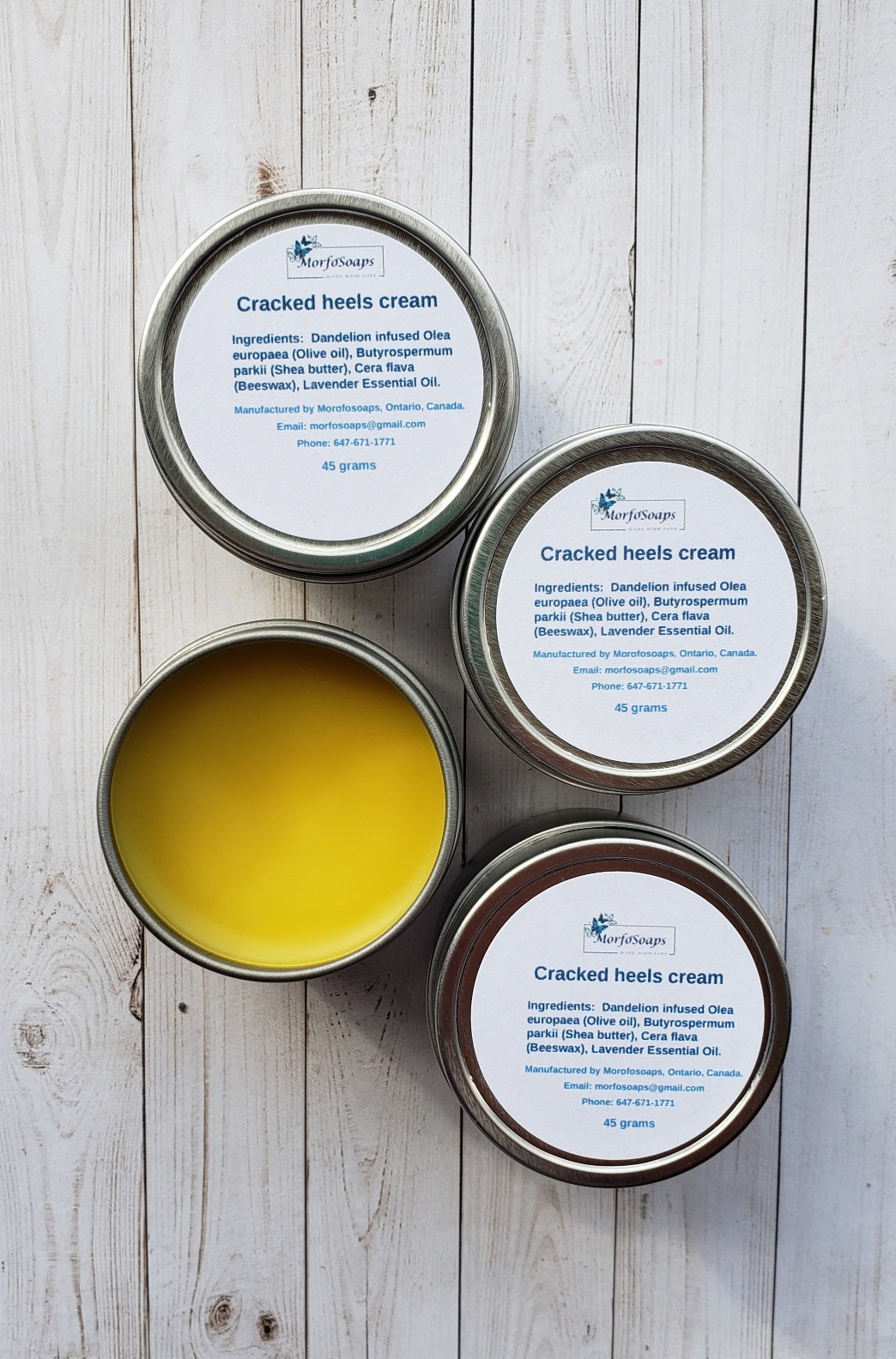 A jar of Handmade Cracked Heels Cream featuring natural ingredients like Dandelion, Shea butter, and beeswax, designed for foot care.