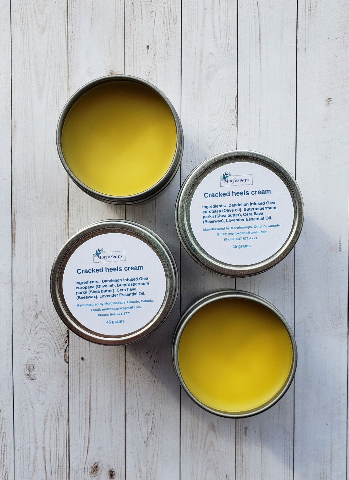 A jar of Handmade Cracked Heels Cream featuring natural ingredients like Dandelion, Shea butter, and beeswax, designed for foot care.