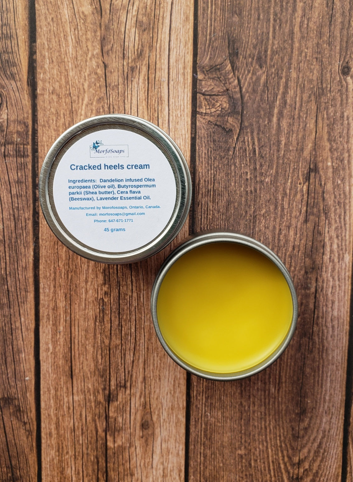 A jar of Handmade Cracked Heels Cream featuring natural ingredients like Dandelion, Shea butter, and beeswax, designed for foot care.