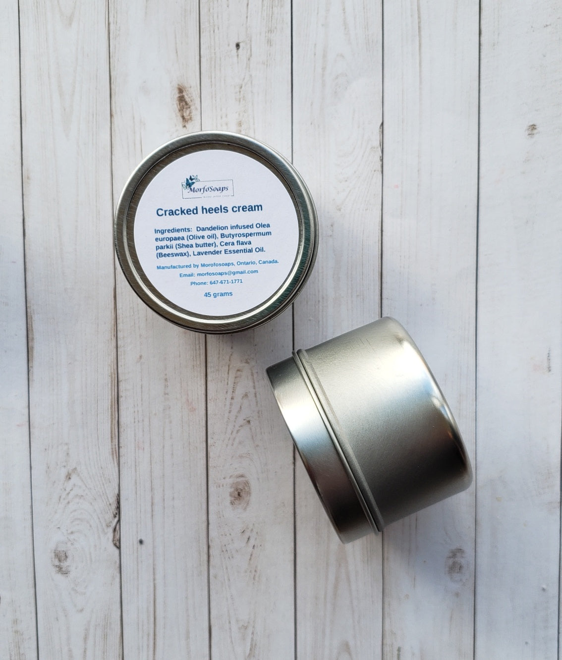 A jar of Handmade Cracked Heels Cream featuring natural ingredients like Dandelion, Shea butter, and beeswax, designed for foot care.