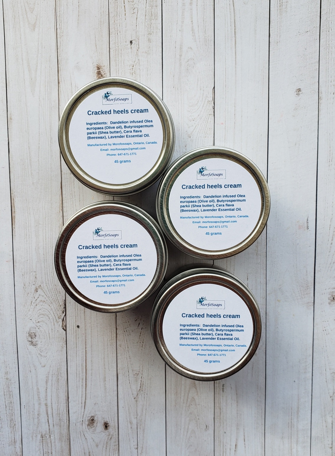 A jar of Handmade Cracked Heels Cream featuring natural ingredients like Dandelion, Shea butter, and beeswax, designed for foot care.