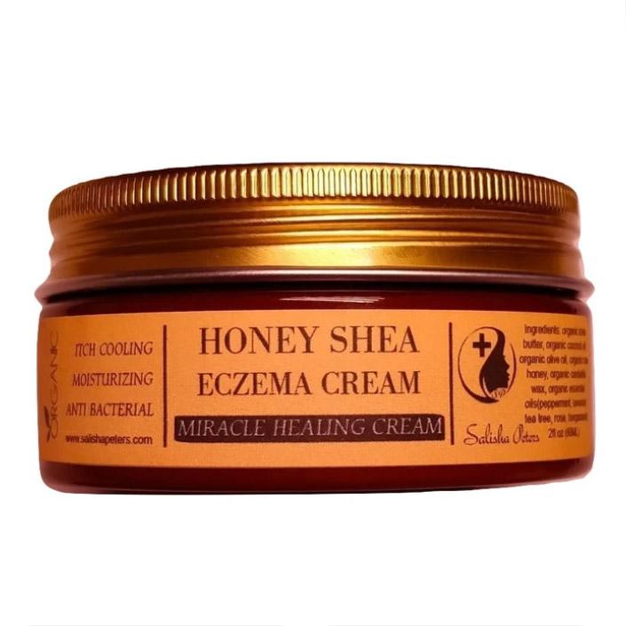 A jar of Healing Honey Eczema Cream with a natural honeycomb background, showcasing its organic ingredients and soothing properties.