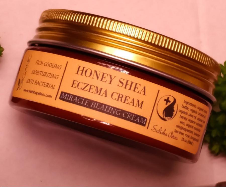 A jar of Healing Honey Eczema Cream with a natural honeycomb background, showcasing its organic ingredients and soothing properties.