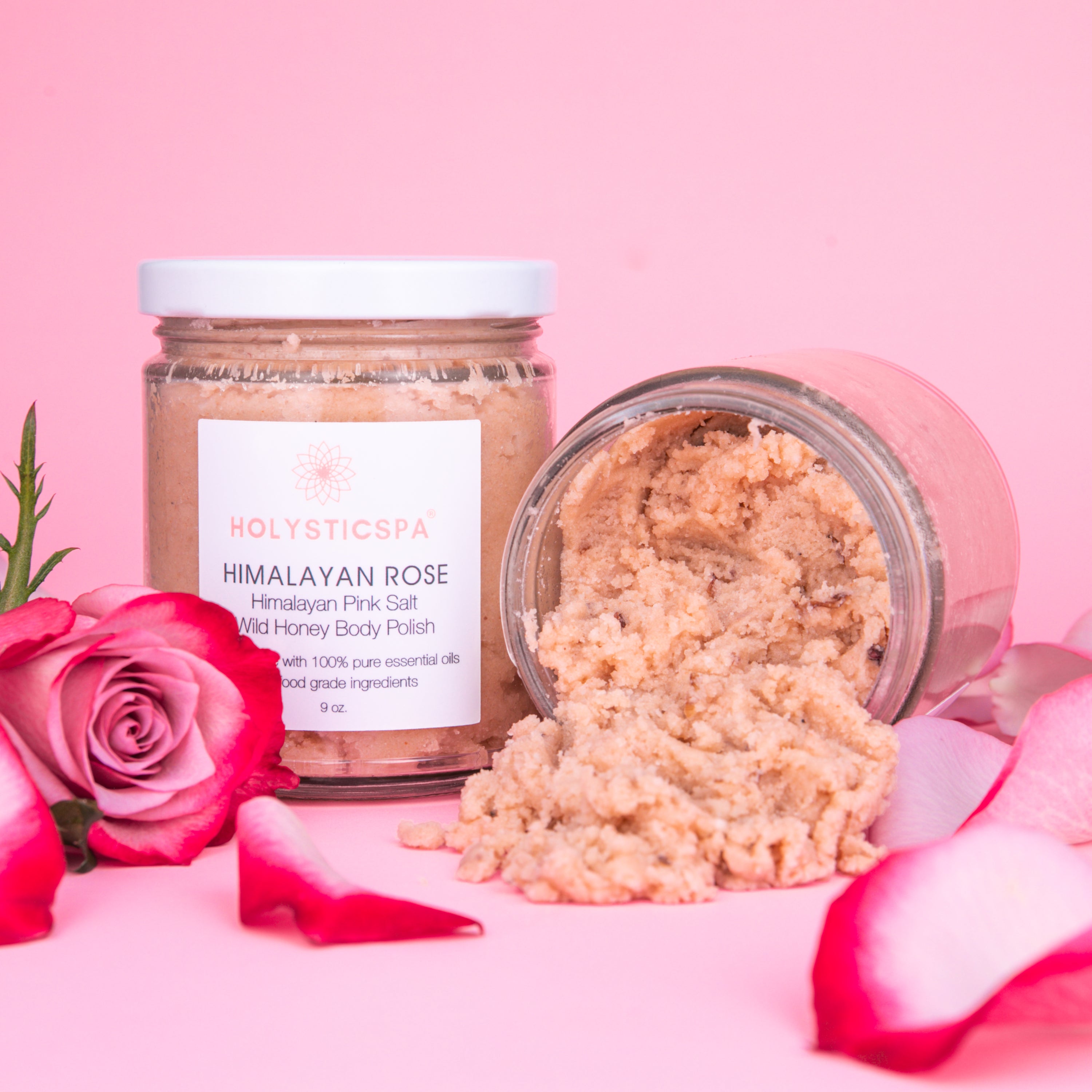 Himalayan Rose Body Polish jar with pink salt and rose petals, showcasing its natural ingredients and luxurious texture.