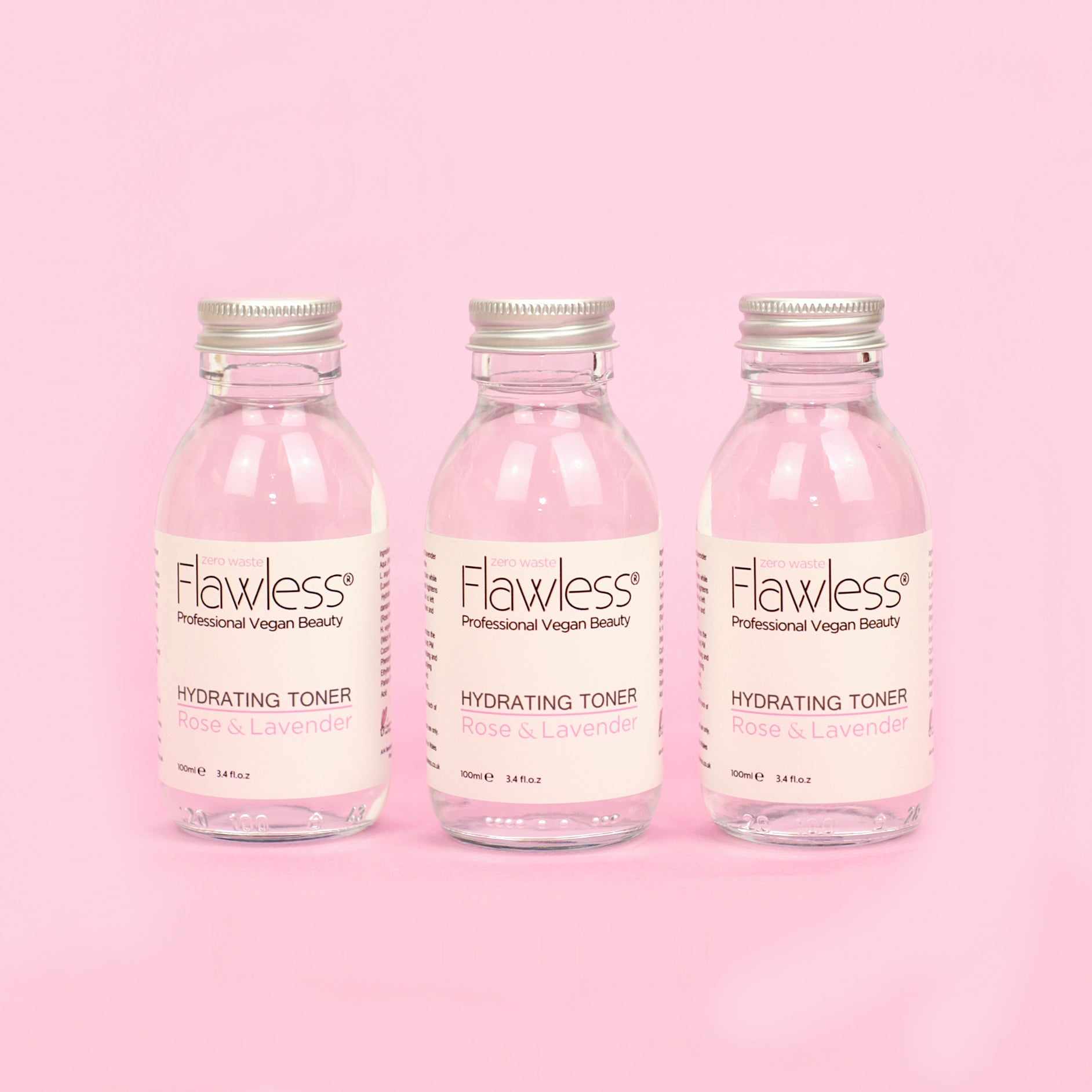 Hydrating Toner in a recycled glass bottle with rose and lavender ingredients, showcasing its eco-friendly packaging.