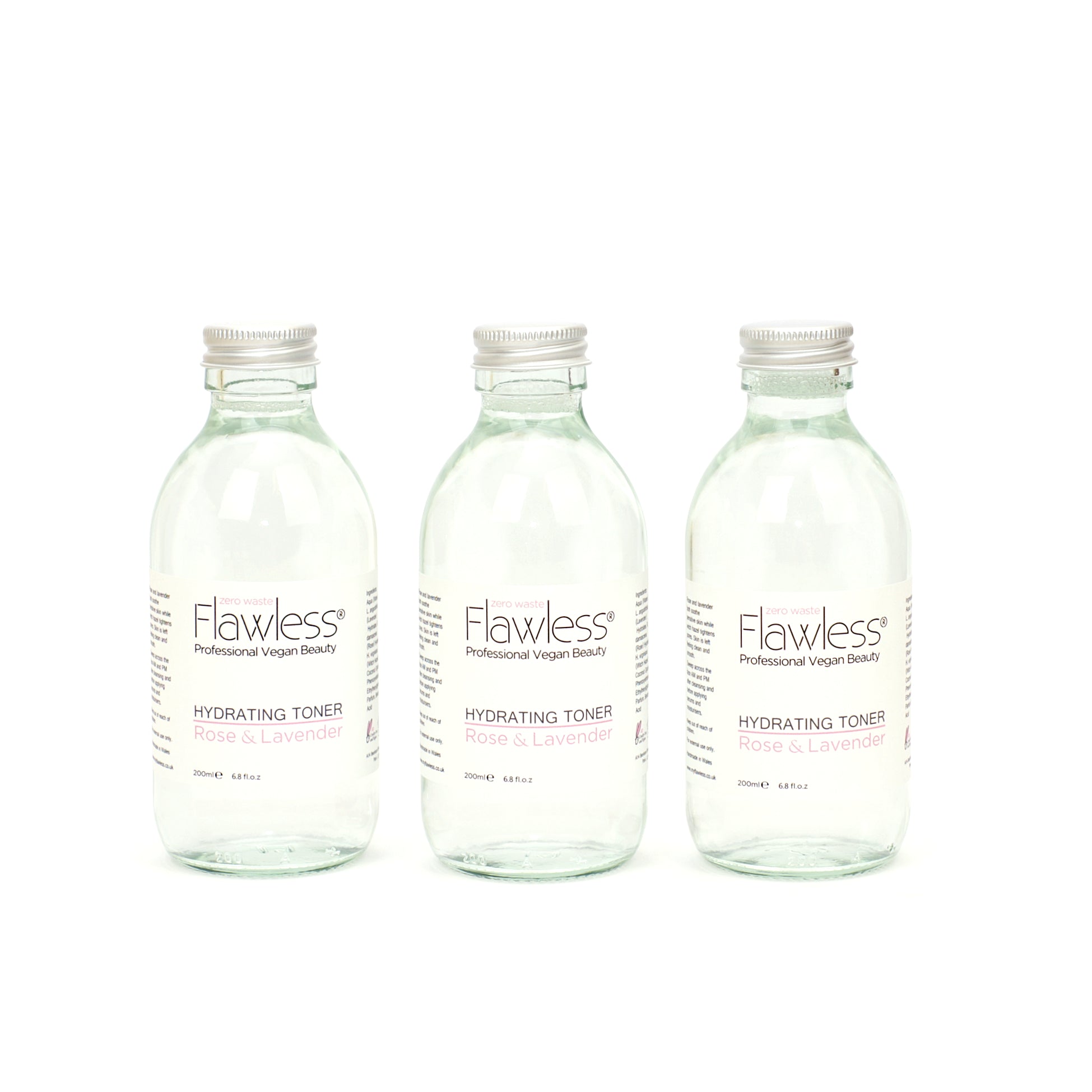 Hydrating Toner in a recycled glass bottle with rose and lavender ingredients, showcasing its eco-friendly packaging.