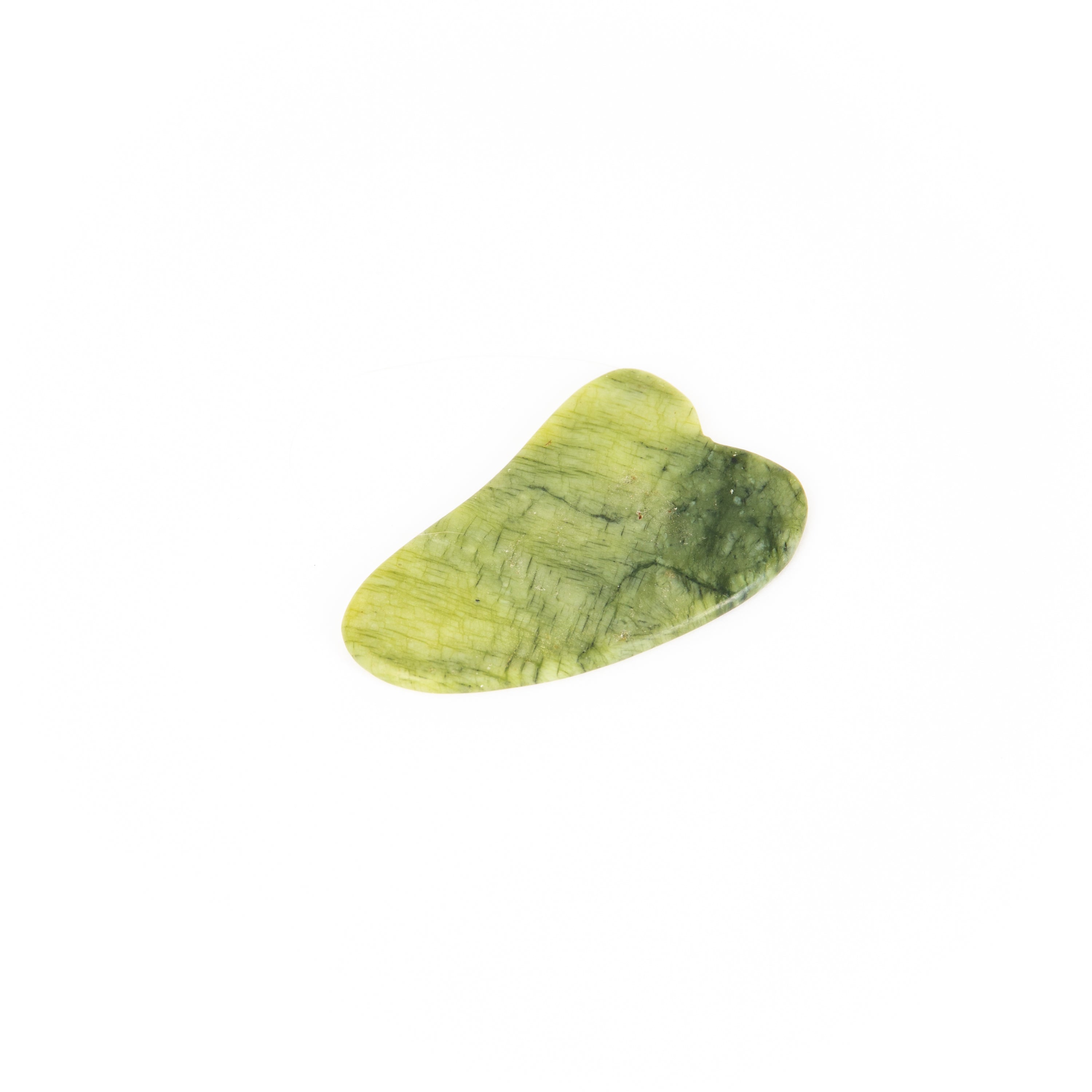 A beautifully crafted green jade Gua Sha tool for facial massage, showcasing its smooth surface and unique shape.