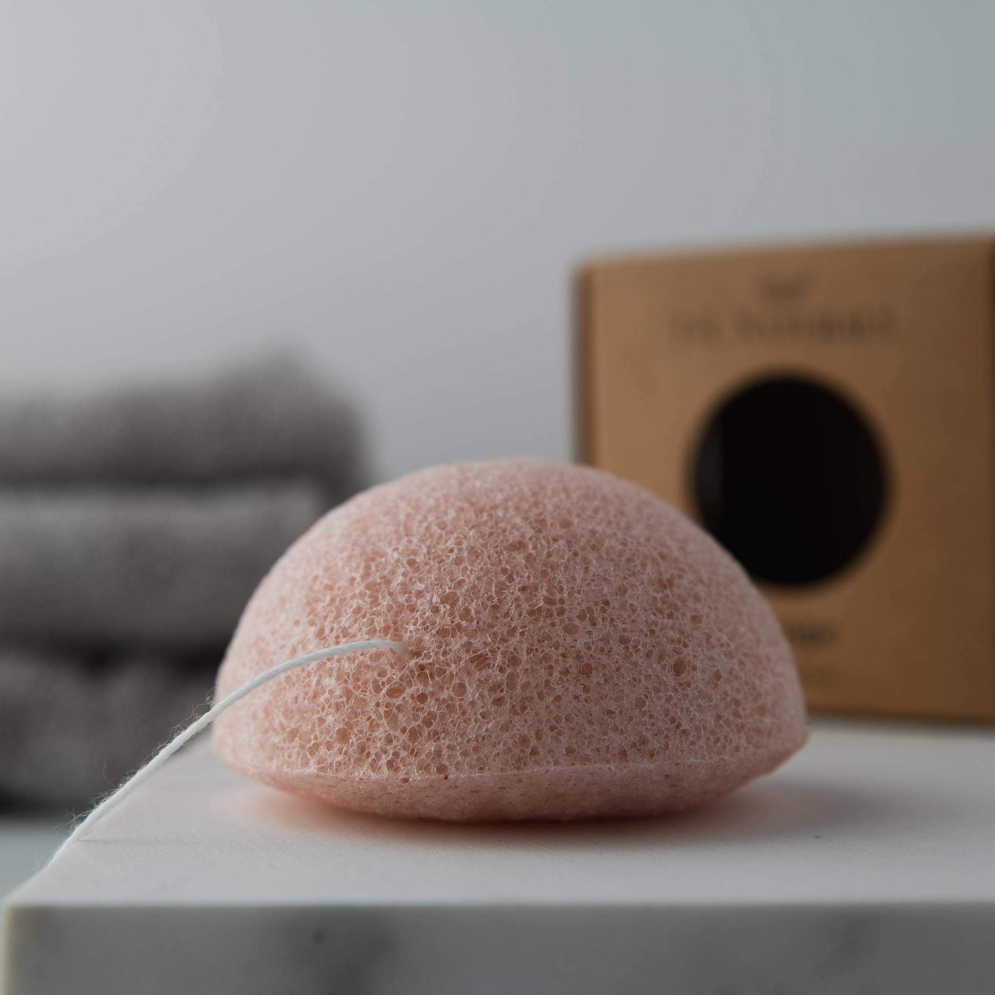 Two biodegradable Konjac sponges in various colors for different skin types, showcasing their natural texture and eco-friendly design.