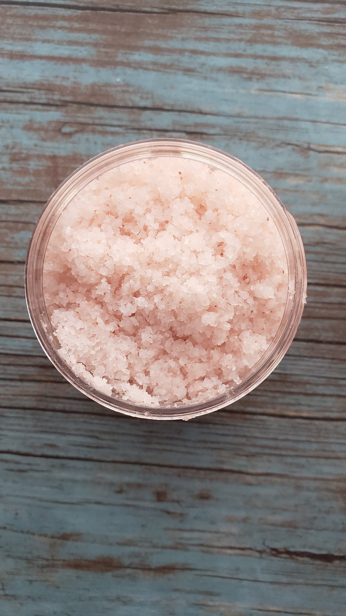 A jar of Lavender Bath Salts with dried lavender buds, showcasing its natural ingredients and soothing properties.