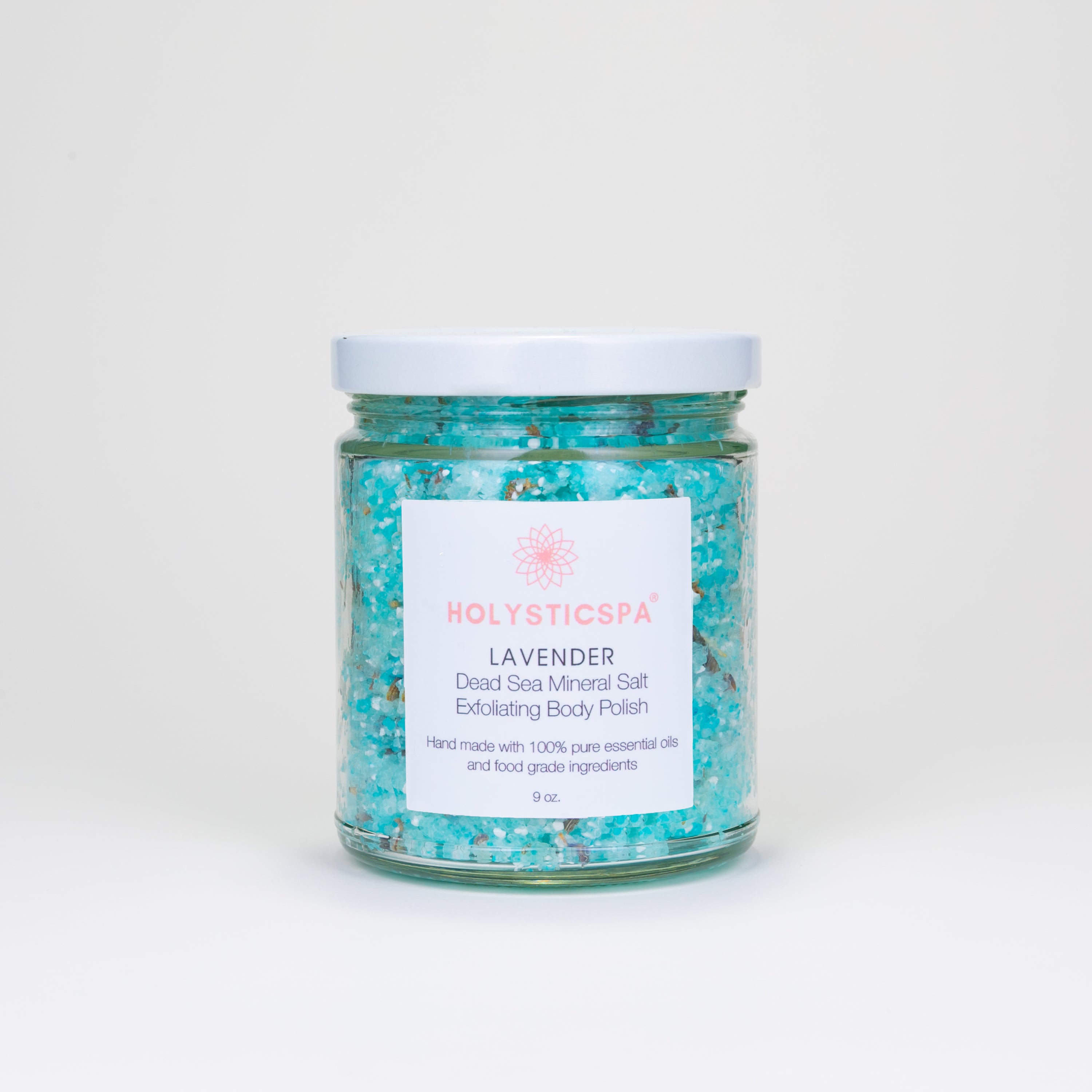 Lavender Body Polish in a glass jar with dried lavender flowers and essential oils, showcasing its natural ingredients and soothing properties.