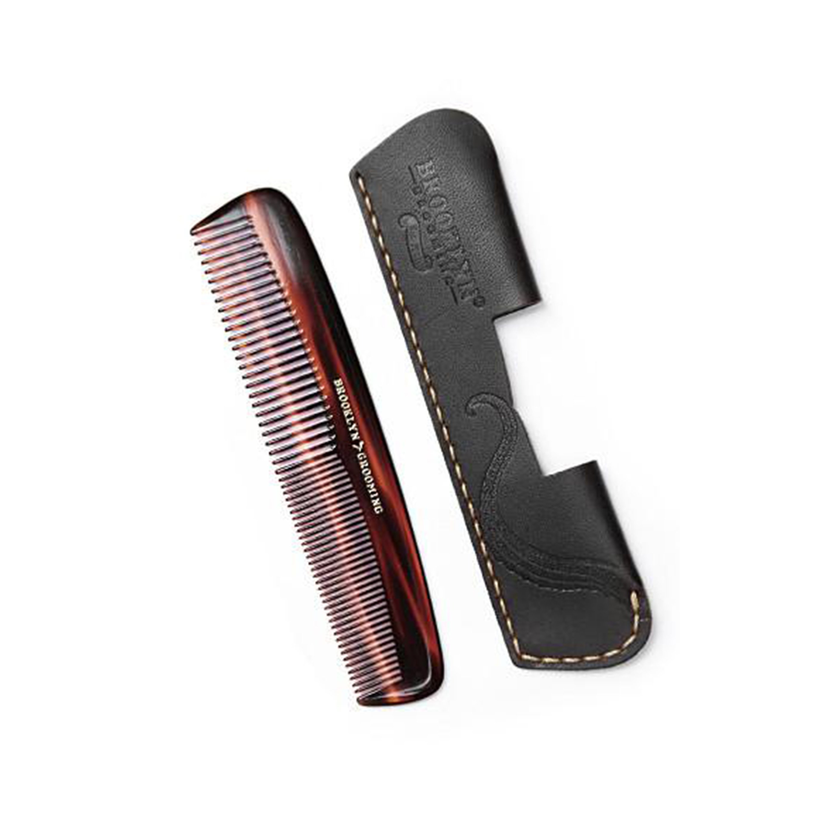 A luxurious leather comb sleeve with a pocket comb, featuring black leather and gold stitching, handcrafted in the USA.