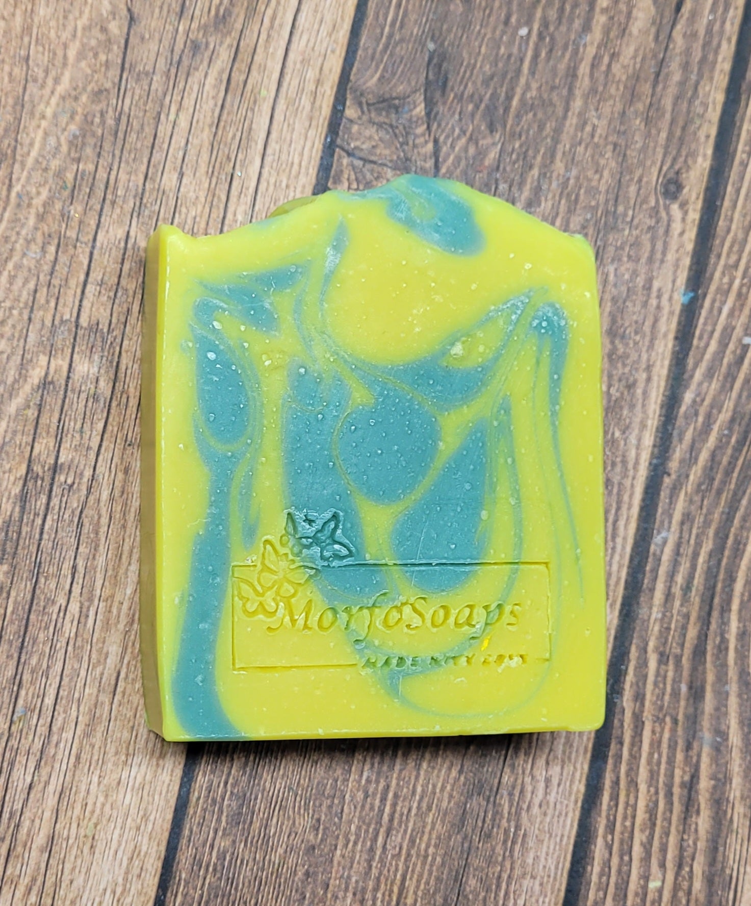 Handmade Lemon Eucalyptus Soap bar with natural ingredients, showcasing its unique design and texture.