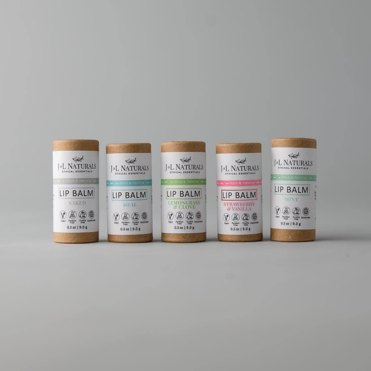 A collection of five lip balms in various flavors, showcasing their vibrant packaging and natural ingredients.