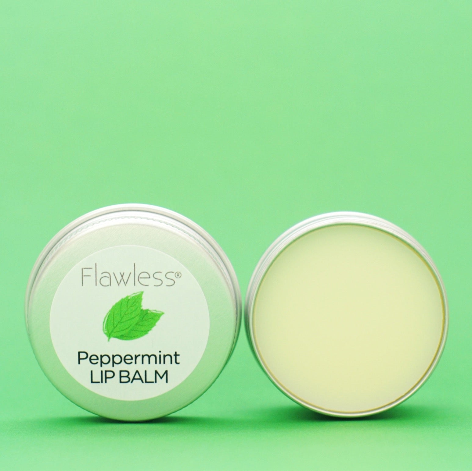 A tin of Peppermint Lip Balm featuring a minty green color, showcasing its eco-friendly packaging and natural ingredients.